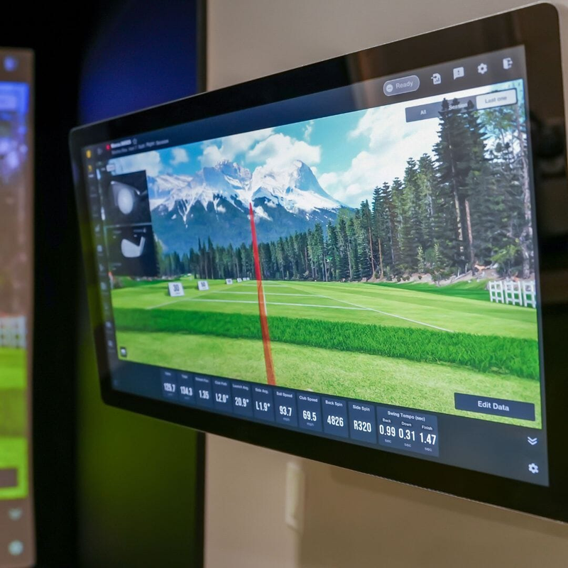 27 inch 4K touch screen monitor wall mounted showing golf simulator shot data.