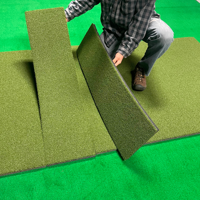 Big Moss True Launch Hitting Mat with man holding hitting strips.