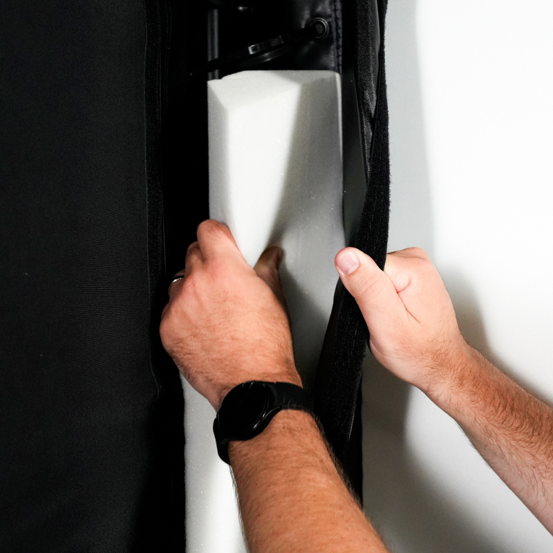 Carl's Place Foam Insert Kit being installed on a DIY Golf Simulator Enclosure Package.