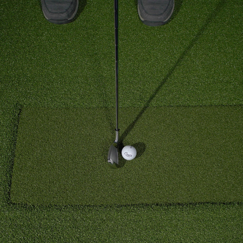 Carl's Place HotShot Golf Hitting Mat with Hitting Strip and golf club and ball.