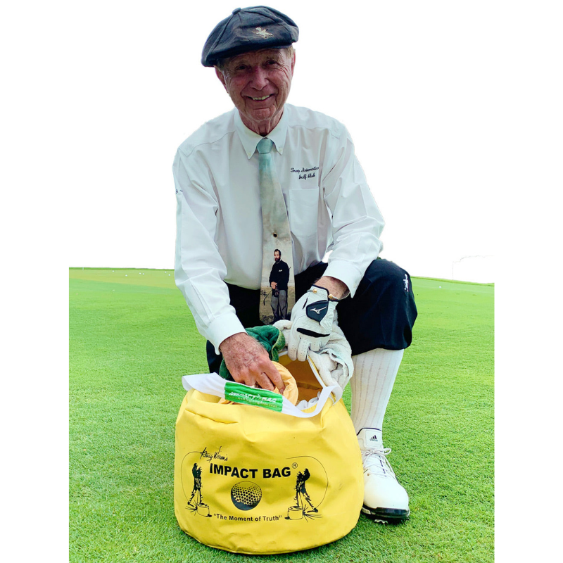 Golf Impact Bag® by Dr. Gary Wiren with golfer kneeling.