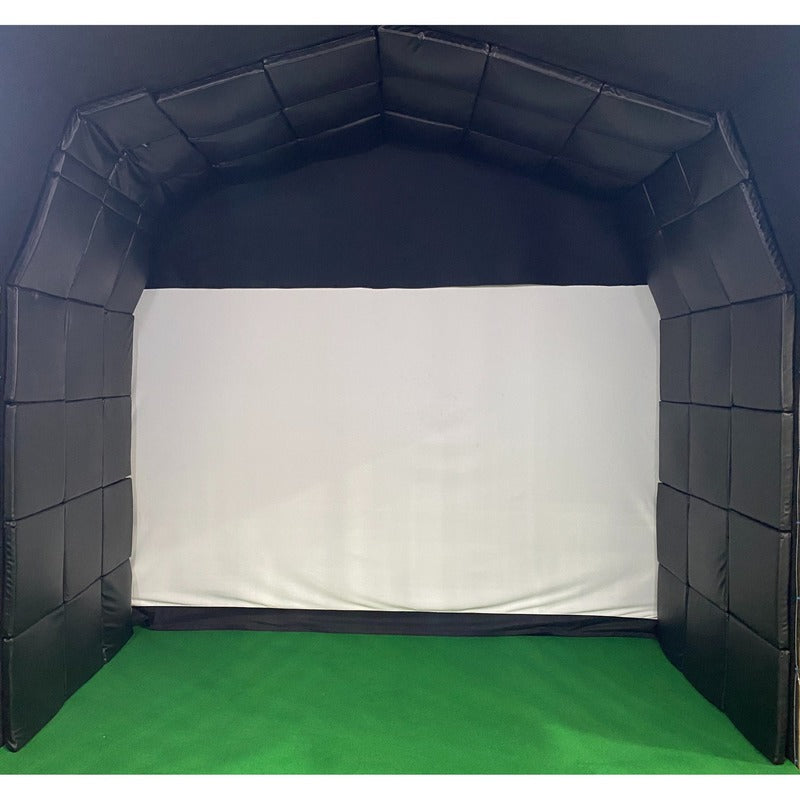 Impact Sports golf simulator bay enclosure and impact screen set up against a dark wall.