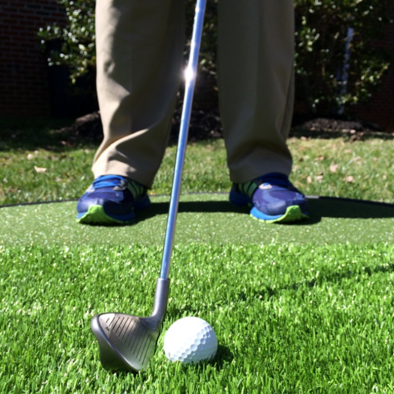 Pro Putt Systems Multi Surface Chipping Pad closeup of the golf ball driver on a green turf.