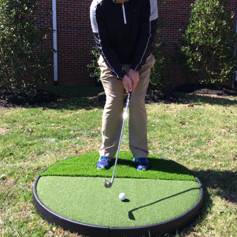 Pro Putt Systems Multi Surface Chipping Pad golfer addressing ball on green mat.