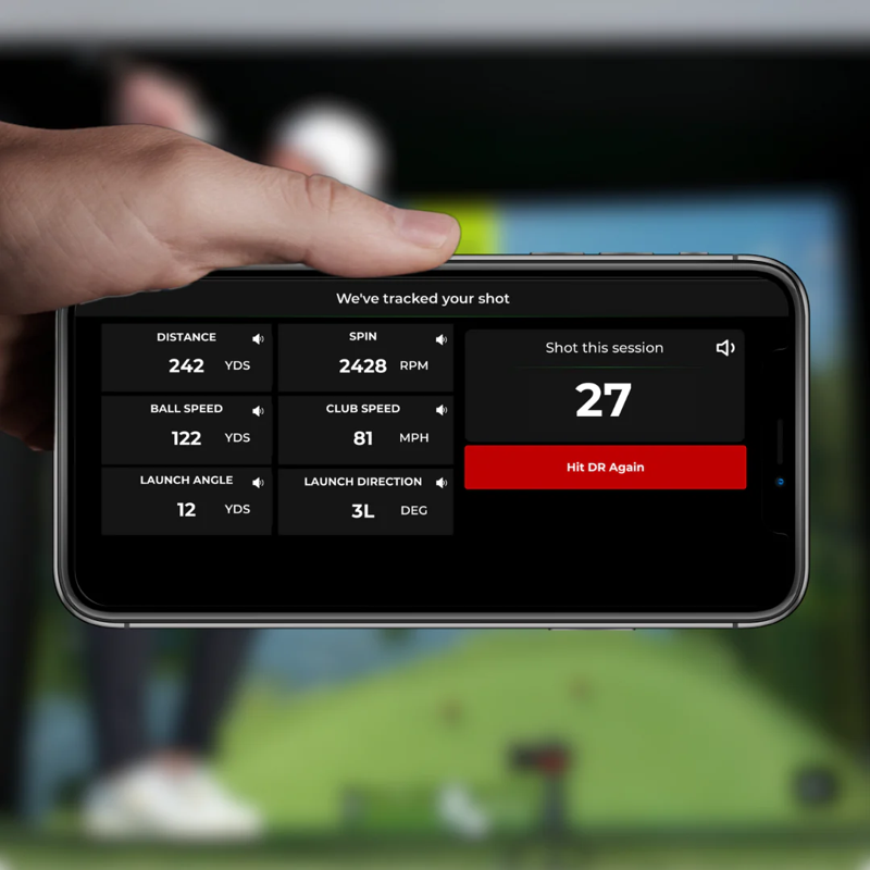 Red Stakes Golf Mobile Golf Studio Bundle shot metrics display with man holding a phone with launch stats.