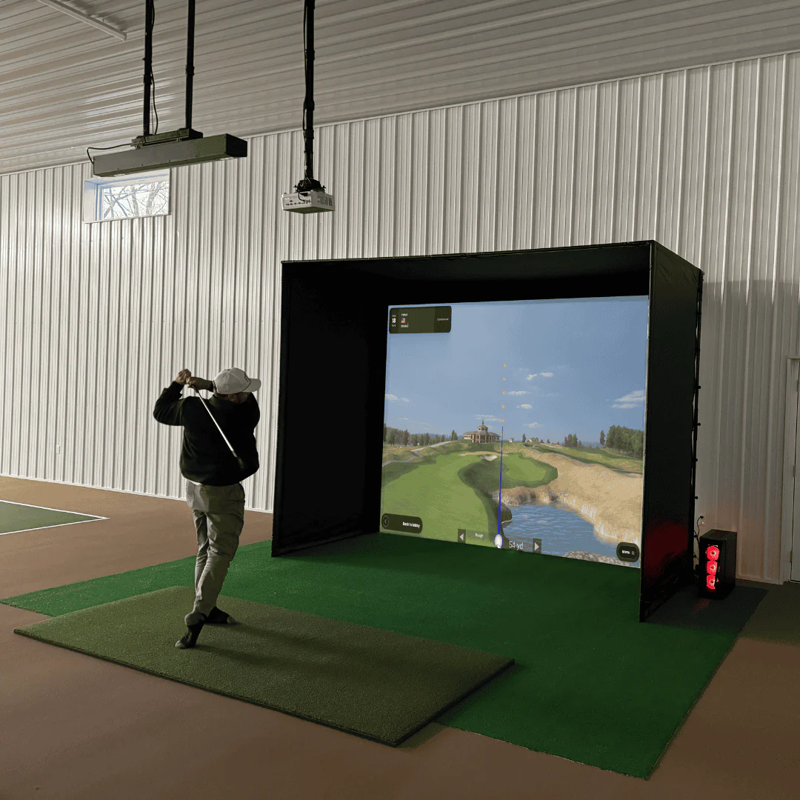 Red Stakes Golf Pro Golf Studio Bundle golfer in action hitting toward impact screen.