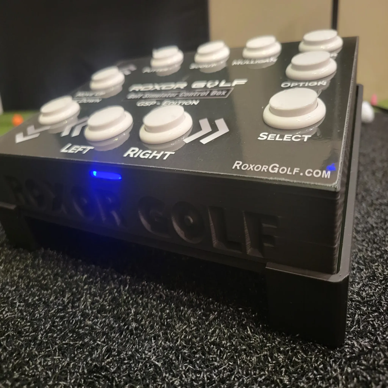 Roxor Golf-Control Box GSP-TB Edition front angle closeup showing white buttons and glossy surface with blue light. 