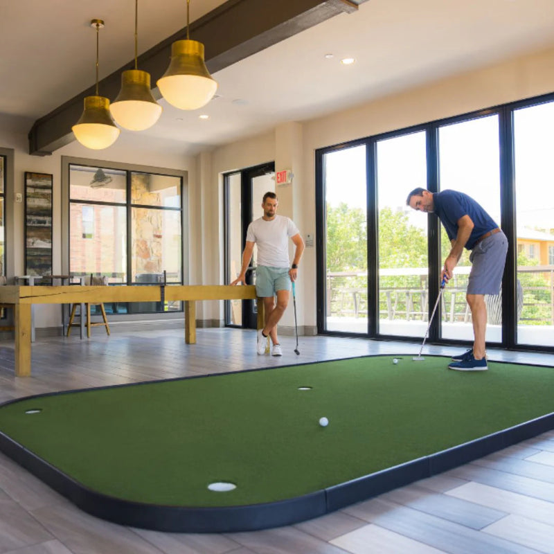 SIGPRO Executive Putting Green golfers practicing.