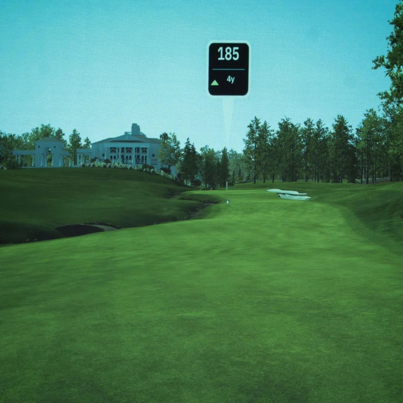 SIGPRO Premier Golf Simulator Impact Screen with a closeup view of a digital fairway showing detailed terrain and distance overlay.