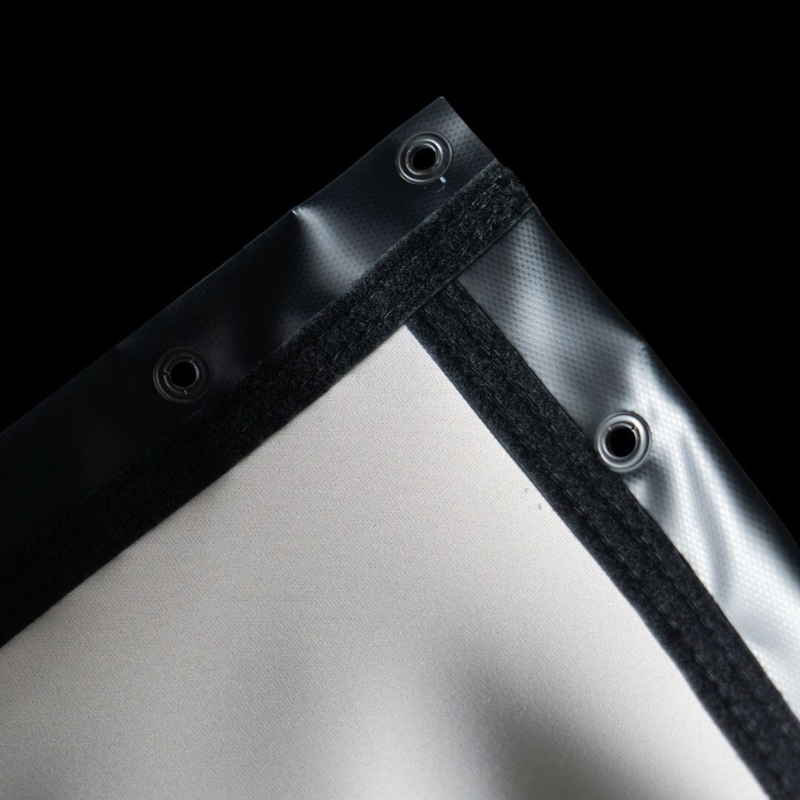 SIGPRO Premier Golf Simulator Impact Screen showing a detailed edge with textured black trim and silver grommets.