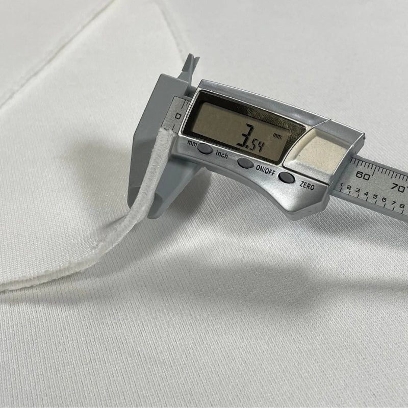 SIGPRO Premium Golf Simulator Impact Screen premium thickness measurer.