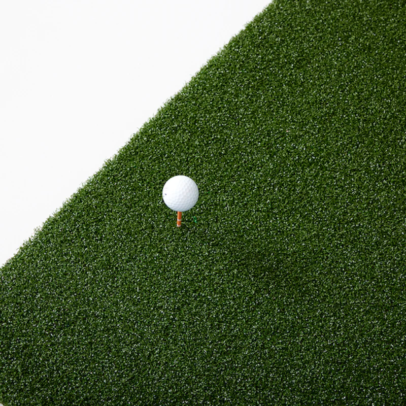 SkyTrak 5x5 Hitting Mat with golf ball on tee.
