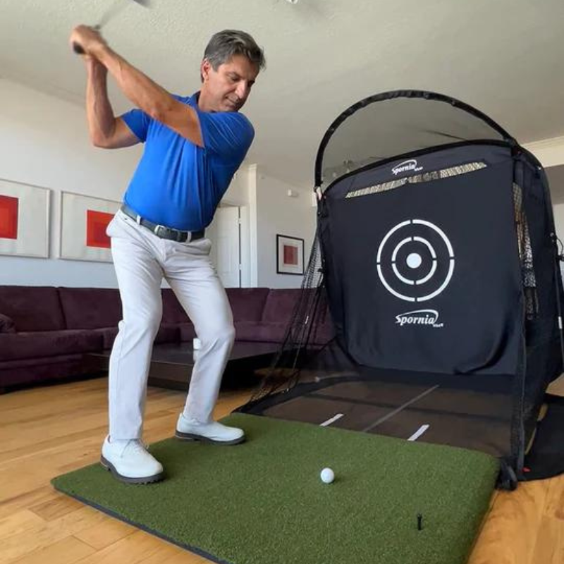 Spornia ProStrike Commercial Golf Mat with net and golfer.