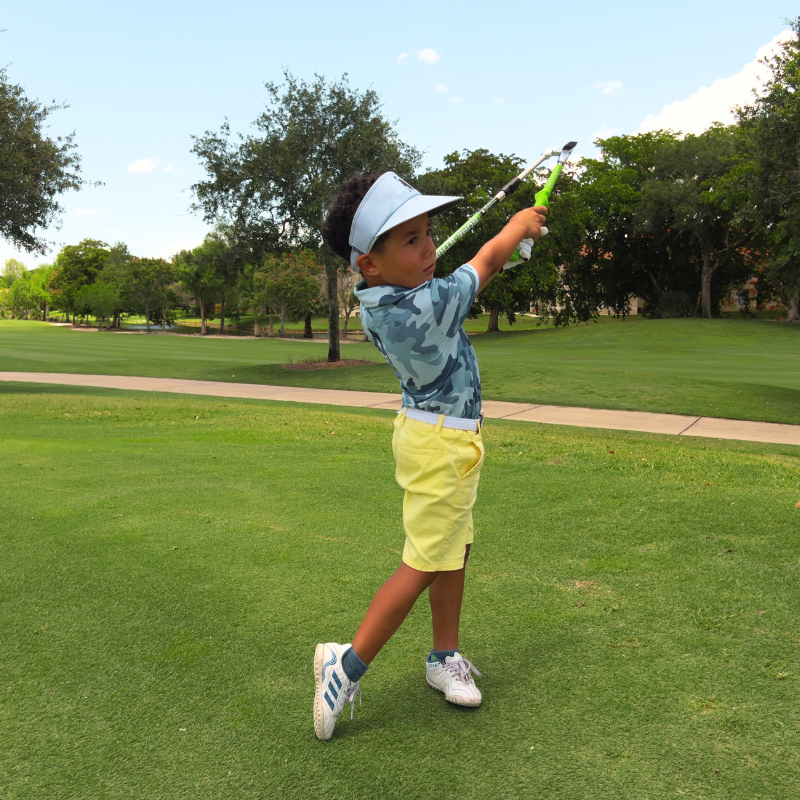 Sure-Strike Jr. by Sure Golf with golfer in followthrough.