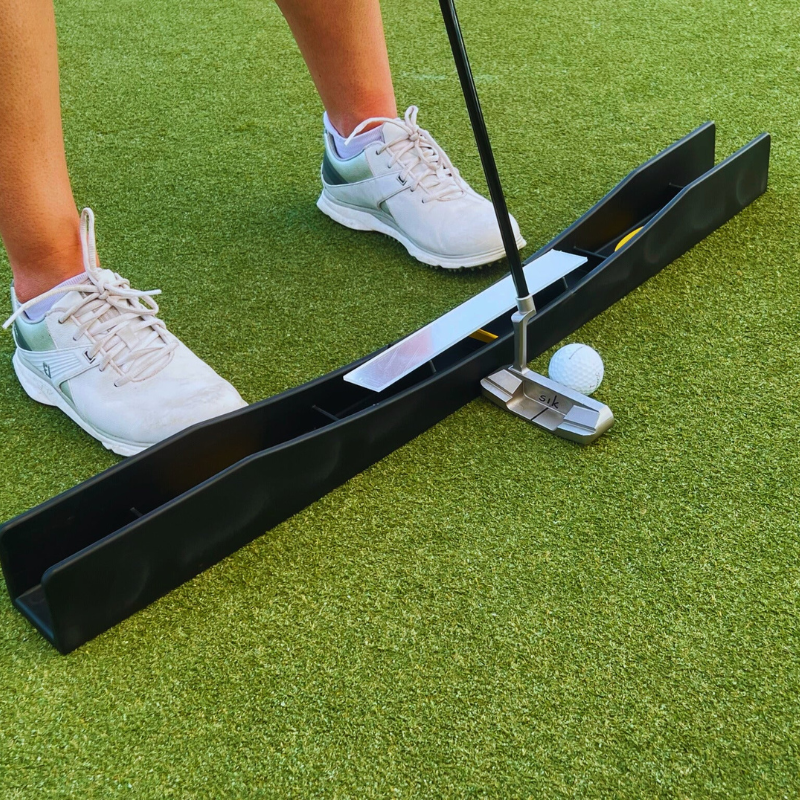 The Putting Arc MS-3D black side view with putter addressed to ball.