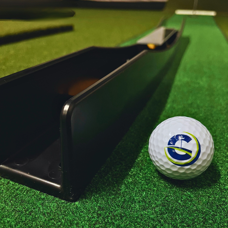 The Putting Arc MS-3D black close view with golf ball.