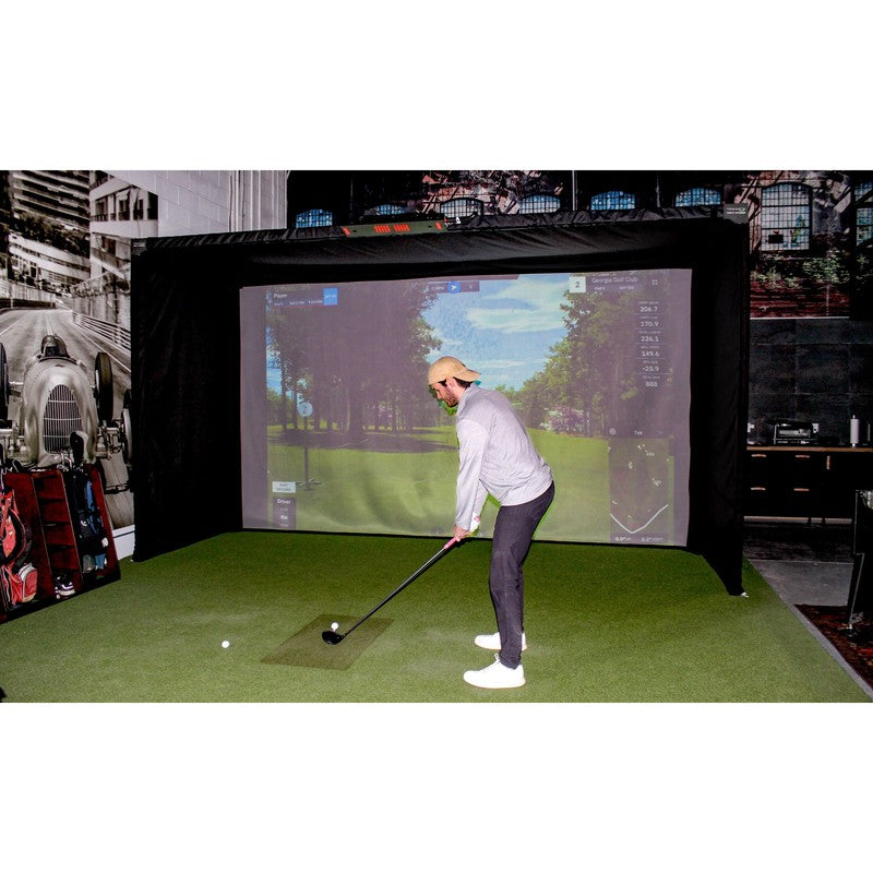 The SportsScreen Parlour Series Golf Simulator Enclosure golfer swinging indoors.
