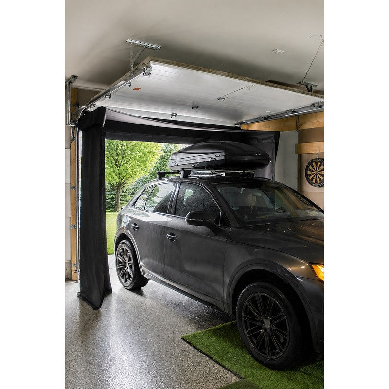 The SportsScreen Vanish LITE Series Golf Simulator Enclosure Custom model with car pulling into the garage.