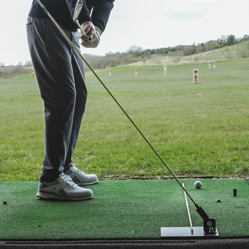 The Swing Plate Base with golfer in takeaway position.