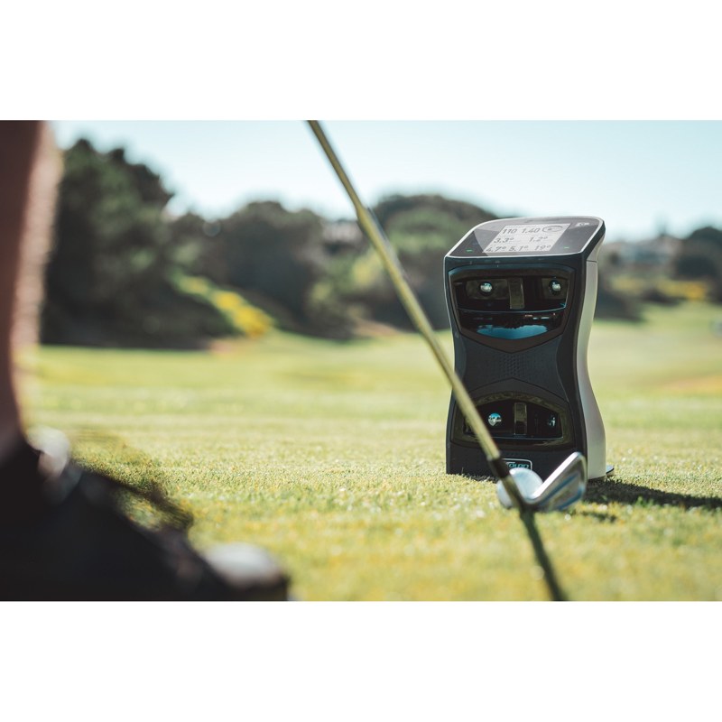 Golfer using the Foresight Sports GCQuad Launch Monitor in a simulator